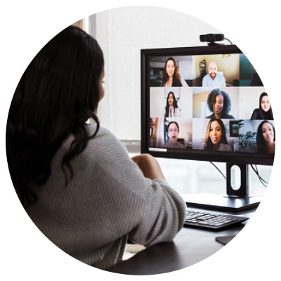 Young woman video conferencing with colleagues