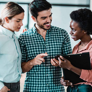 Three coworkers  talking together at work