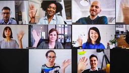 A group of employees wave on a collage of web conferencing screenshots