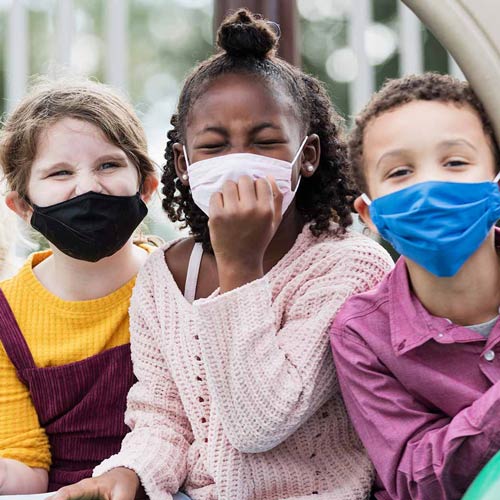 Three Children Wearing Masks