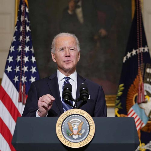 President Joe Biden giving a speech and gesturing