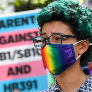 Masked Women Wearing a Pride Mask