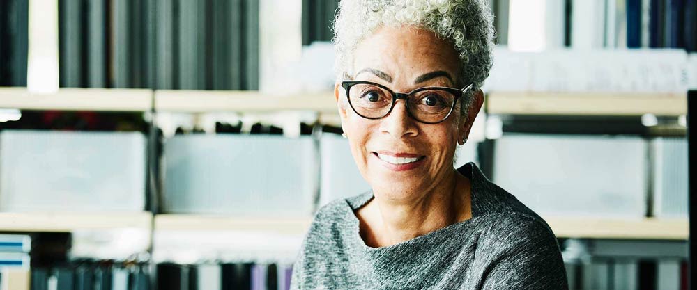 Woman with glasses smiling