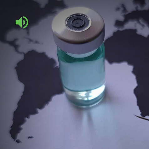 Vaccine vial sitting on a world map