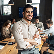 A man at work smiling.