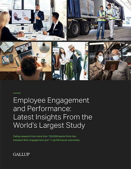 Report cover for Gallup’s Perspective on How to Align Your Employee Compensation and Talent Management Strategies, featuring a manager working on a project with his team